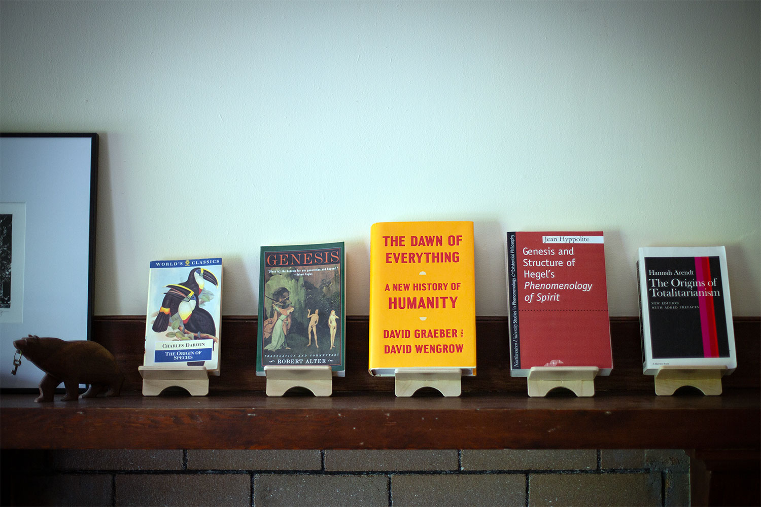 A display of books on the mantel