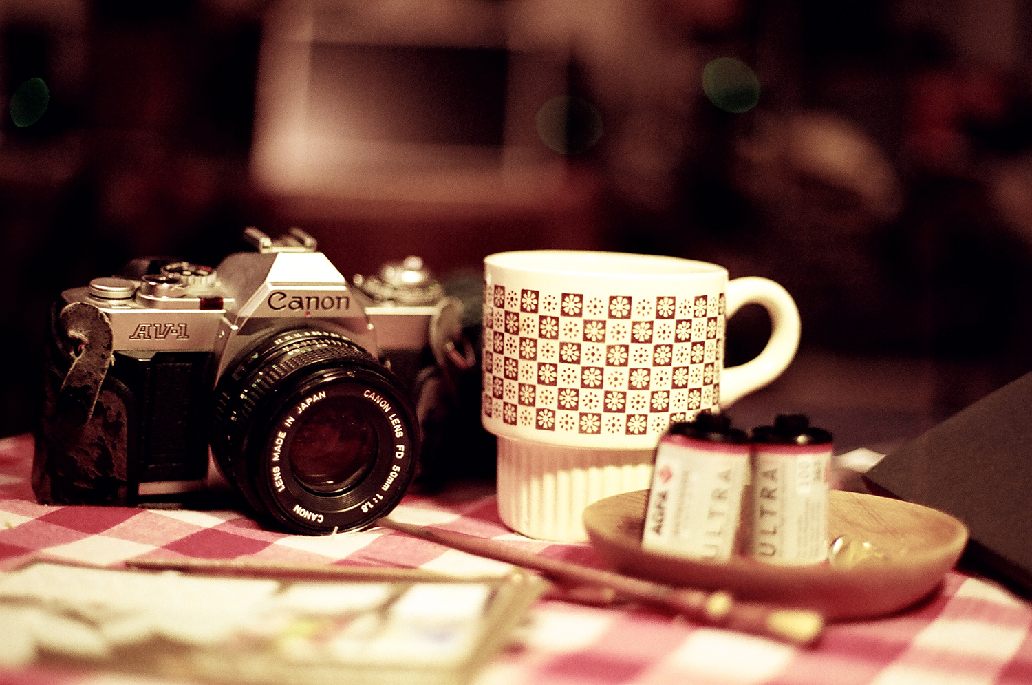 coffee and camera and film at home