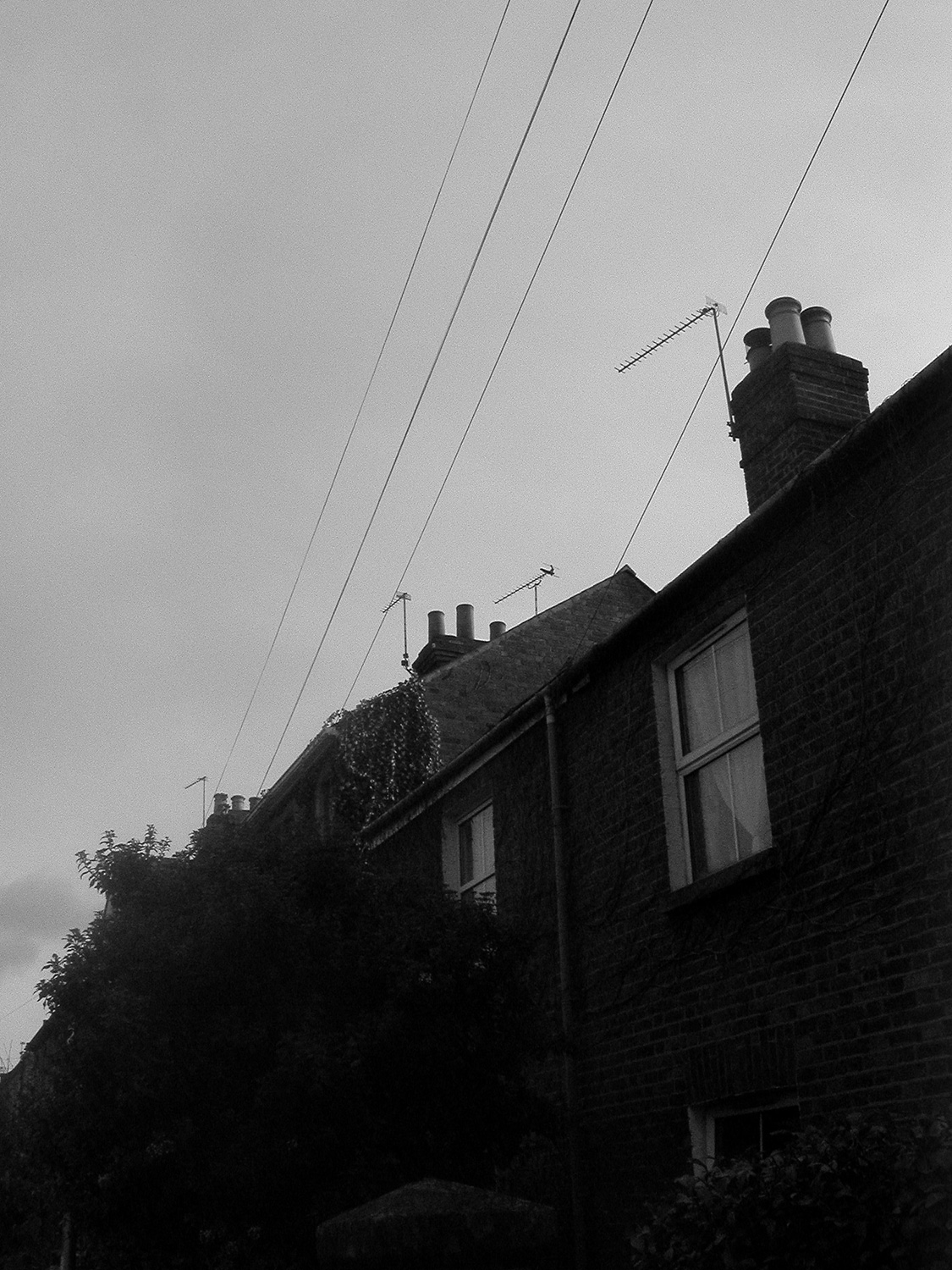 Power lines, row houses.