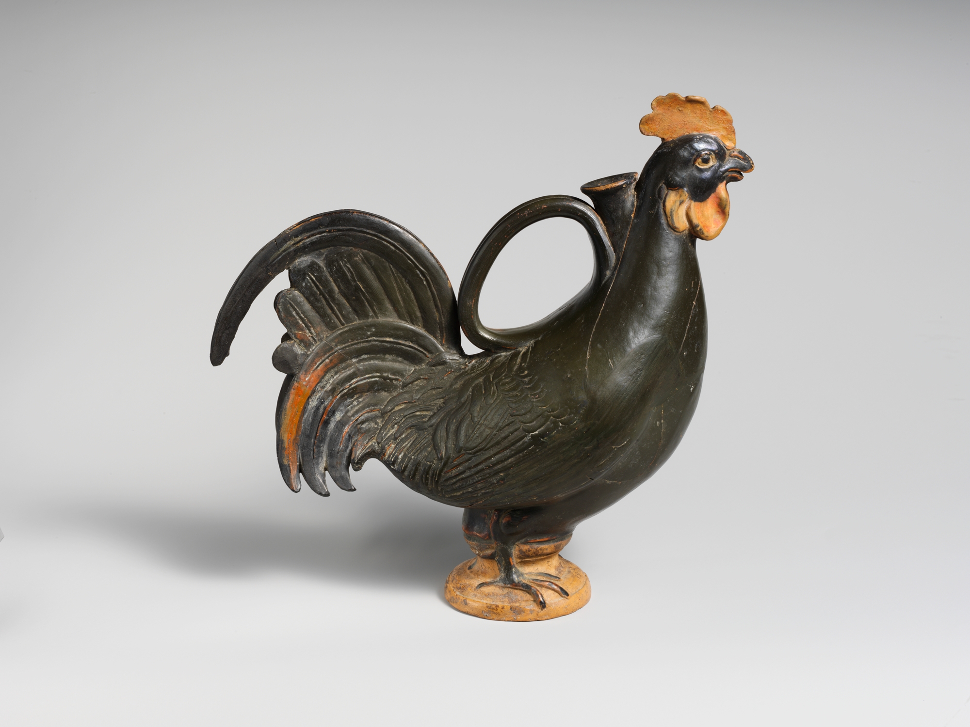 A ceramic rooster flask