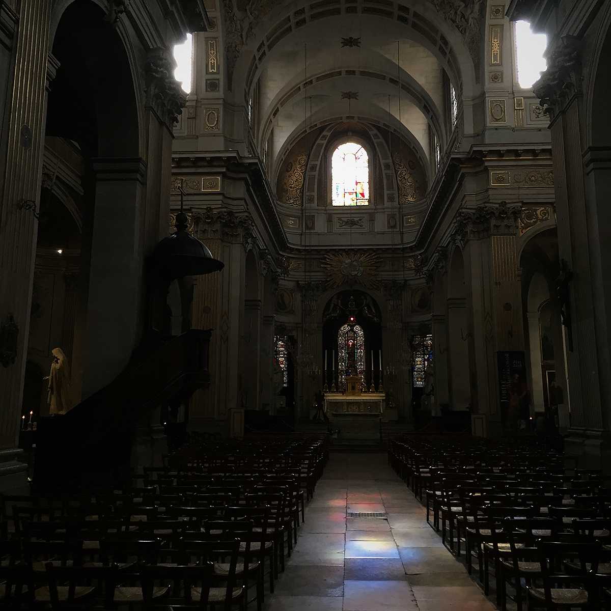 light from a stained glass window on the floor of Saint-Louis-en-l'Île