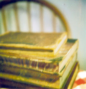 books on a table, with chair